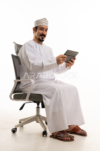 Omani Man with Tablet on White Background