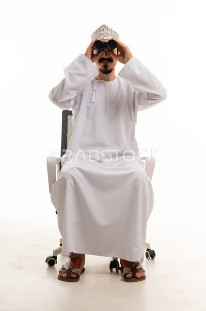 Omani Man with Binoculars Sitting in Office Chair