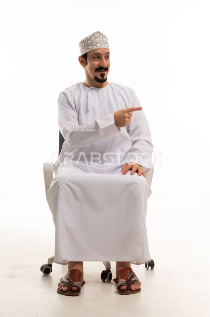 Omani Man Pointing in Traditional Dress on White Background