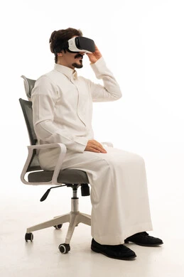 Saudi Man Wearing VR Headset in Office Chair