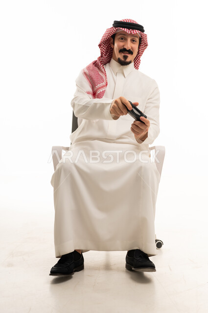 Saudi Man Playing Video Games on White Background