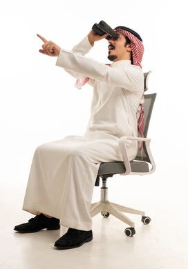 Saudi Man on Office Chair Using Binoculars