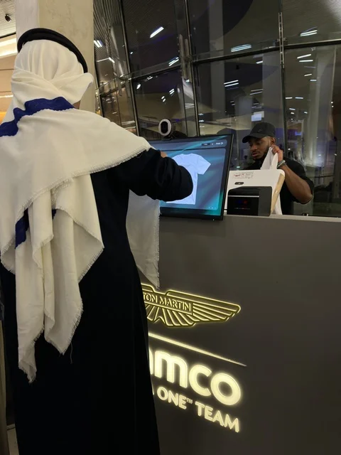 Saudi Man at Ithra Dhahran Using Digital Kiosk