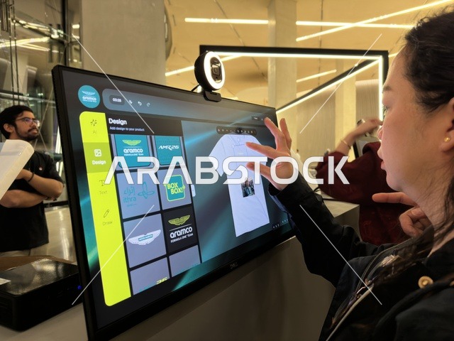 Woman Using Digital Interactive Screen at Ithra Dhahran