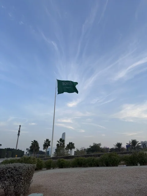 Saudi Arabian Flag at Ithra Dhahran with Blue Sky