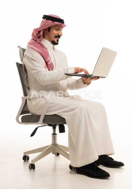 Saudi Businessman Using Laptop on Office Chair