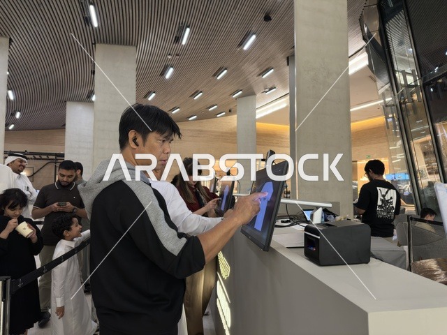 Man Using Digital Touch Screen at Ithra Dhahran