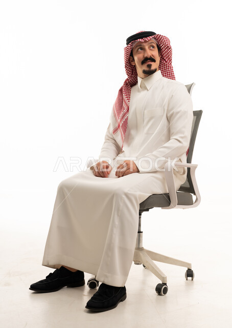 Saudi Businessman Sitting in Office Chair Looking Up