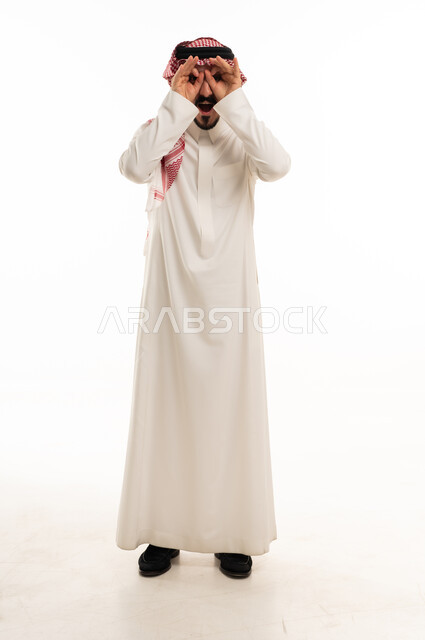 Saudi Man in Thobe Making Binocular Gesture