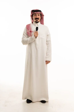 Saudi Man in Traditional Thobe Holding Microphone