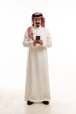 Saudi Man in Traditional Thobe Using Smartphone Studio