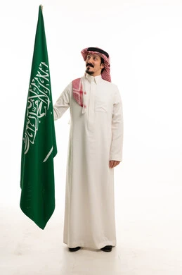 Saudi Man Holding Saudi Arabia Flag on White Background
