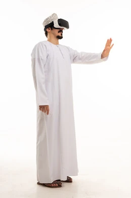 Omani Man in Traditional Dress Using VR Headset