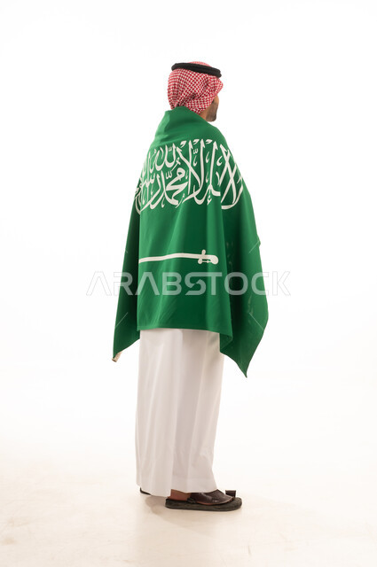 Saudi Man in Traditional Thobe and Flag Back View