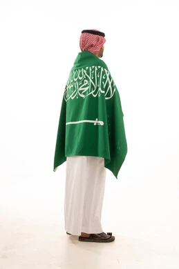 Saudi Man in Traditional Thobe and Flag Back View