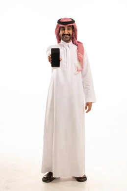 Saudi Man in Thobe Holding Smartphone on White Background