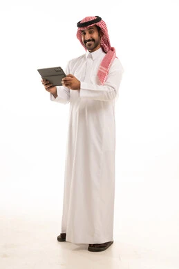 Saudi Man in Traditional Thobe Holding Digital Tablet