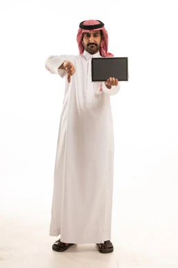 Saudi Man in Thobe Holding Tablet with Thumbs Down