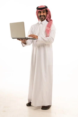 Saudi Man in Traditional Thobe Holding Laptop Studio Shot