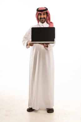 Saudi Man in Traditional Thobe Holding Laptop