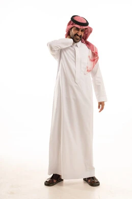 The need for rest and a treatment plan, feeling muscle tension in the neck, inflammation of the muscles and joints, feeling tired and exhausted, a portrait of a Saudi Arabian Gulf man wearing traditional attire and a headscarf, placing his hand on his neck with gestures of pain in the shoulders, full-body image, white background.