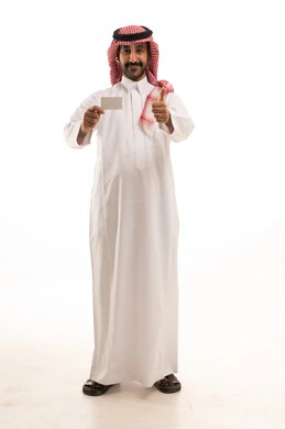 A portrait of a Saudi Arabian Gulf man wearing traditional attire and a ghutrah, pointing to a blank white card, with various gestures and signs, against a white background.