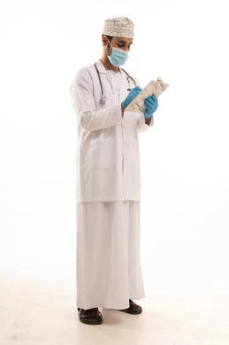 Writing medical reports, working in the health sector, a portrait of an Arab Gulf Omani doctor wearing a dishdasha, turban, medical coat, and mask, holding a stethoscope, full-body, white background.