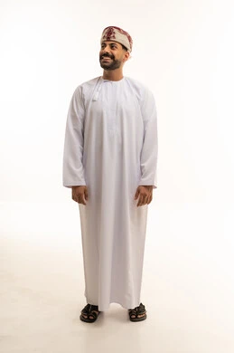 Smiling Omani Man in Traditional Dress White Background