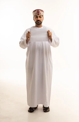 Omani Man Holding Blank Paper in Traditional Dress