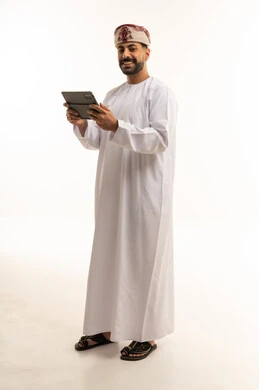Omani Man with Tablet in Traditional Dress