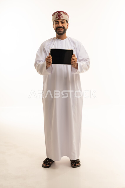 Omani Man Holding Digital Tablet on White Background