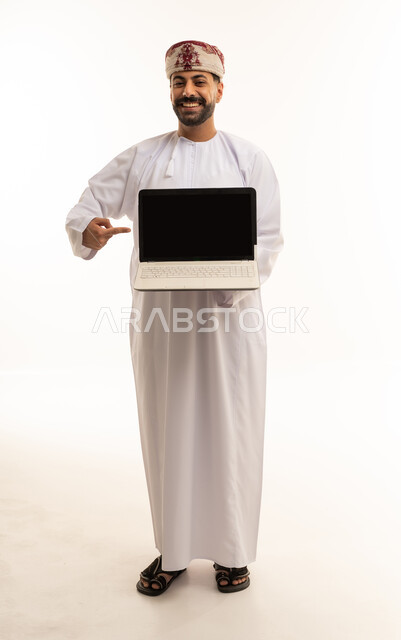 Omani Man Pointing at Laptop Screen on White Background