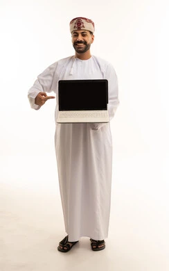 Omani Man Pointing at Laptop Screen on White Background