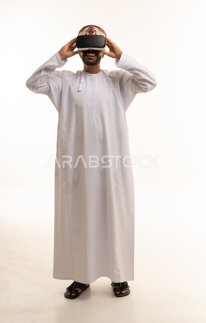 Omani Man in Traditional Dress Using VR Headset