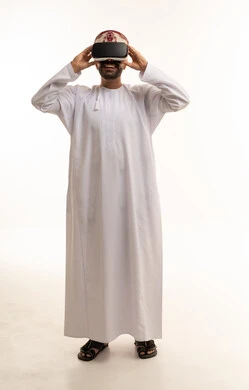Omani Man in Traditional Dress Using VR Headset