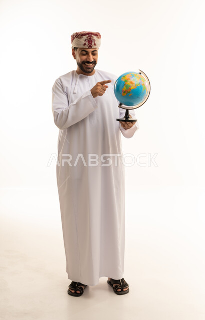Omani Man Holding Globe on White Background