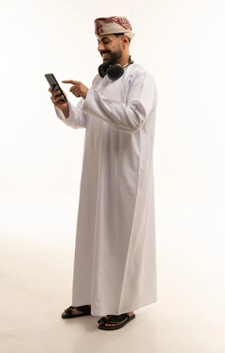 Omani Man with Smartphone and Headphones Studio