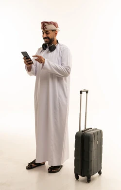 Omani Man with Suitcase and Smartphone on White Background