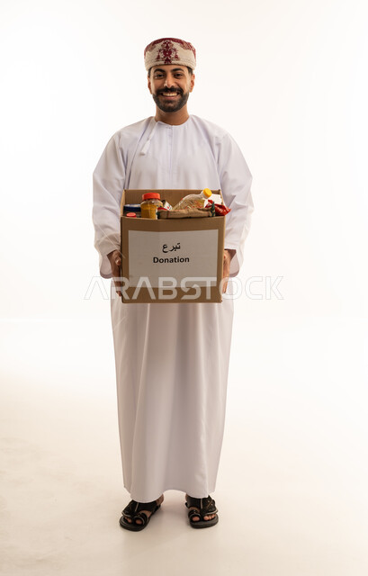 Omani Man Holding Donation Box in Traditional Dress