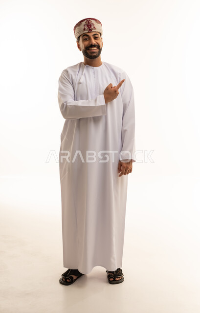Omani Man in Traditional Dishdasha Pointing to Side