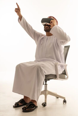 Omani Man Wearing VR Headset on Office Chair