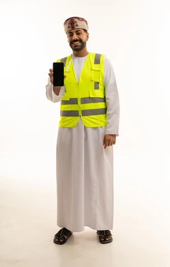 Omani Worker in Safety Vest Holding Smartphone Screen