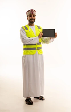 Omani Engineer Holding Digital Tablet in Safety Vest