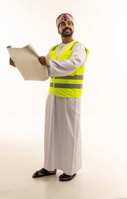 Omani Engineer Holding Construction Blueprints Studio