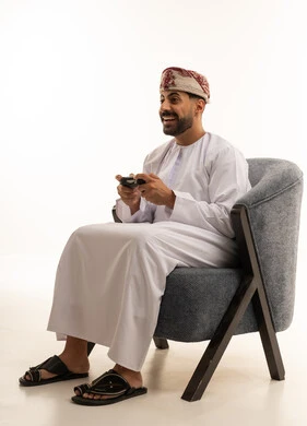 Omani Man Playing Video Games in Studio