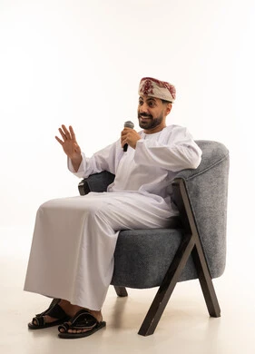 Omani Man with Microphone in Studio Presentation
