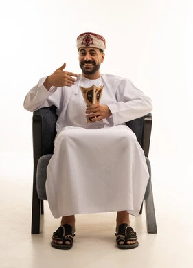 Omani Man in Traditional Clothing Holding Incense Burner