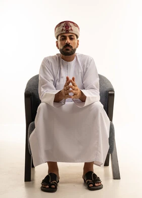 Omani Man in Traditional Dishdasha and Kummah