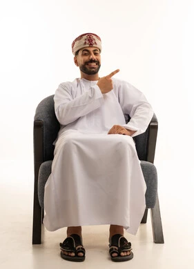 Omani Man in Traditional Dress Pointing on White Background