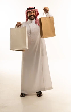 Saudi Man Holding Shopping Bags on White Background
